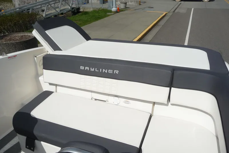 Slide: The Image of 2021 Bayliner VR5 Bowrider I/O boat with cushioned seating at the stern. - 8