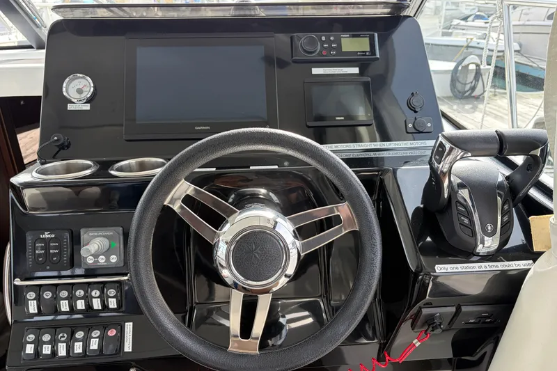 Slide: The Image of Cockpit of 2022 Jeanneau NC Weekender 1095 Fly with steering wheel and controls. - 12