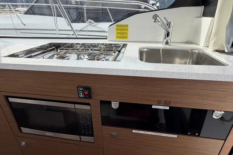 Slide: The Image of Interior of 2022 Jeanneau NC Weekender 1095 Fly with kitchen amenities. - 14