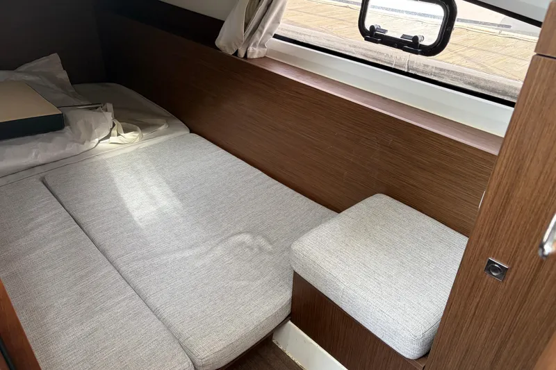 Slide: The Image of Interior cabin of 2022 Jeanneau NC Weekender 1095 Fly with bed and window. - 18