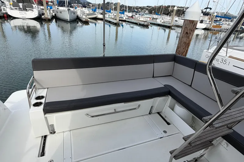 Slide: The Image of 2022 Jeanneau NC Weekender 1095 Fly boat seating area at marina. - 20