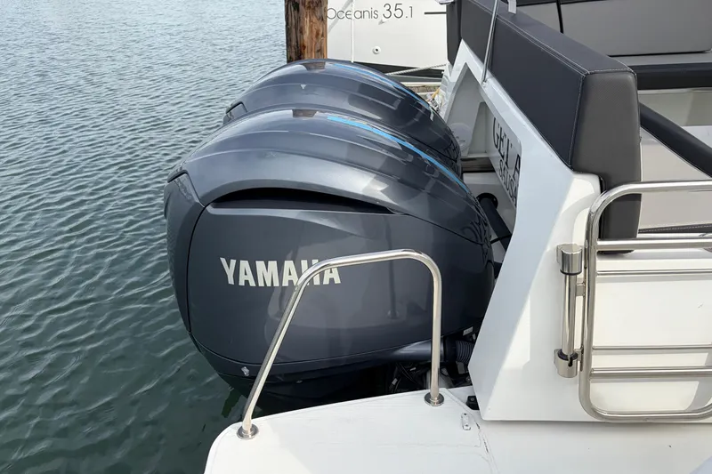Slide: The Image of Twin Yamaha outboard engines on a 2022 Jeanneau NC Weekender 1095 Fly boat. - 21