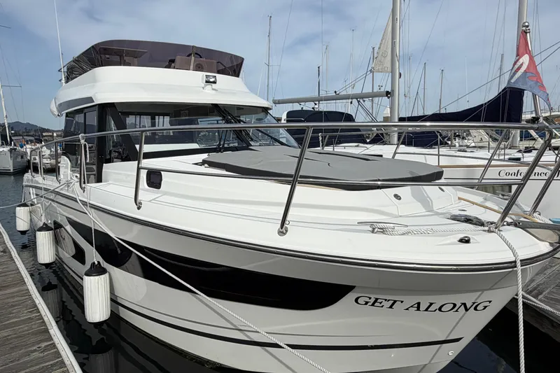 Slide: The Image of 2022 Jeanneau NC Weekender 1095 Fly docked at marina, side view. - 26