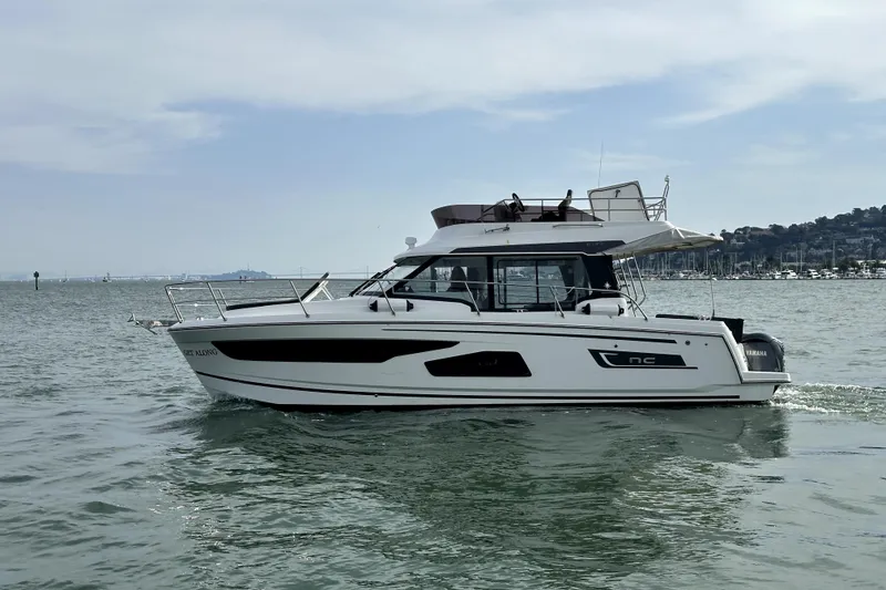 Slide: The Image of 2022 Jeanneau NC Weekender 1095 Fly cruising on calm waters. - 3