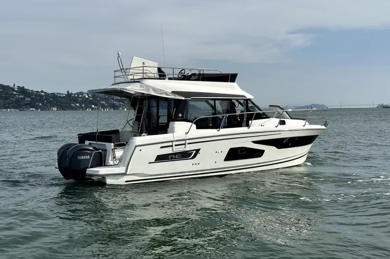 Slide: The Image of 2022 Jeanneau NC Weekender 1095 Fly cruising on open water. - 8