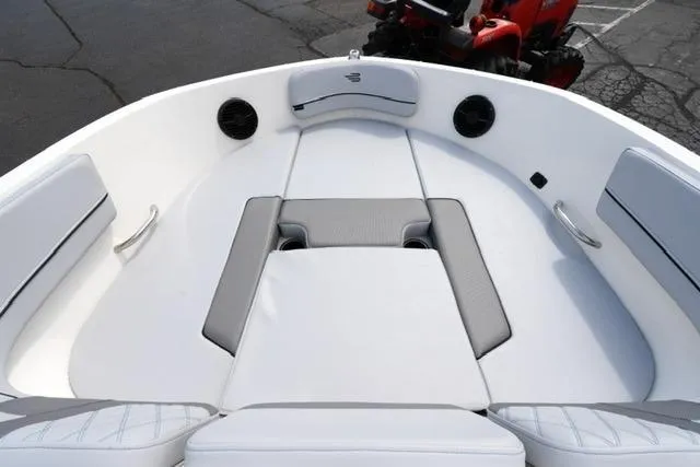 Slide: The Image of 2026 Bayliner VR6 Bowrider I/O boat interior with white seating and modern design. - 11