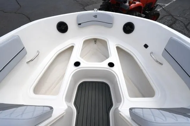 Slide: The Image of 2026 Bayliner VR6 Bowrider I/O boat interior with spacious seating and modern design. - 13