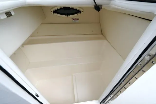 Slide: The Image of 2026 Bayliner VR6 Bowrider I/O storage compartment, spacious and well-lit interior. - 15