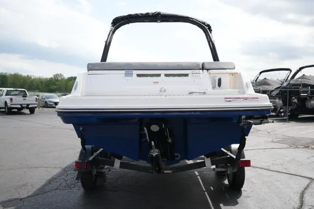Slide: The Image of 2026 Bayliner VR6 Bowrider I/O boat on trailer, rear view in parking lot. - 7