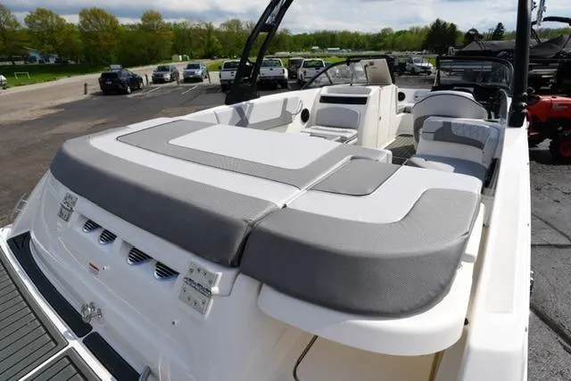 Slide: The Image of 2026 Bayliner VR6 Bowrider I/O boat with spacious seating and sleek design. - 9