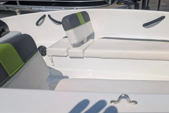 Slide: The Image of 2021 Tahoe T16 boat interior with white and green seating. - 12