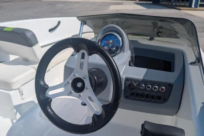 Slide: The Image of Steering console of a 2021 Tahoe T16 boat with dashboard controls. - 3