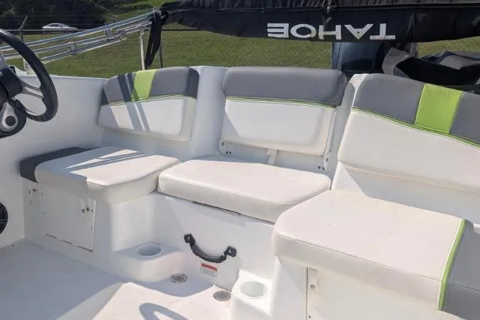 Slide: The Image of Interior seating of a 2021 Tahoe T16 boat with gray and green accents. - 7
