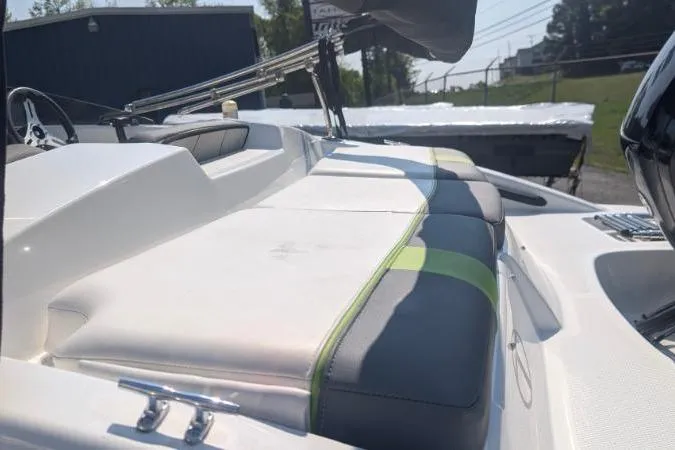 Slide: The Image of 2021 Tahoe T16 boat interior with cushioned seating and steering wheel. - 9
