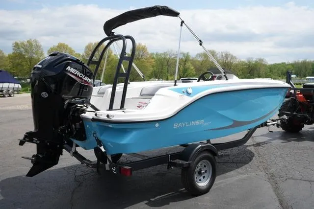 Slide: The Image of 2026 Bayliner M17 boat with Mercury engine on trailer, parked outdoors. - 13