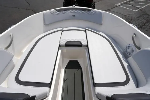 Slide: The Image of 2026 Bayliner M17 boat interior with cushioned seating and sleek design. - 17