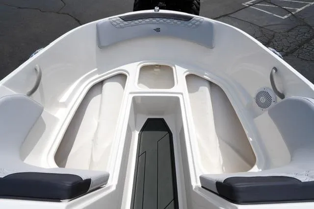 Slide: The Image of 2026 Bayliner M17 boat interior with seating and storage compartments. - 18