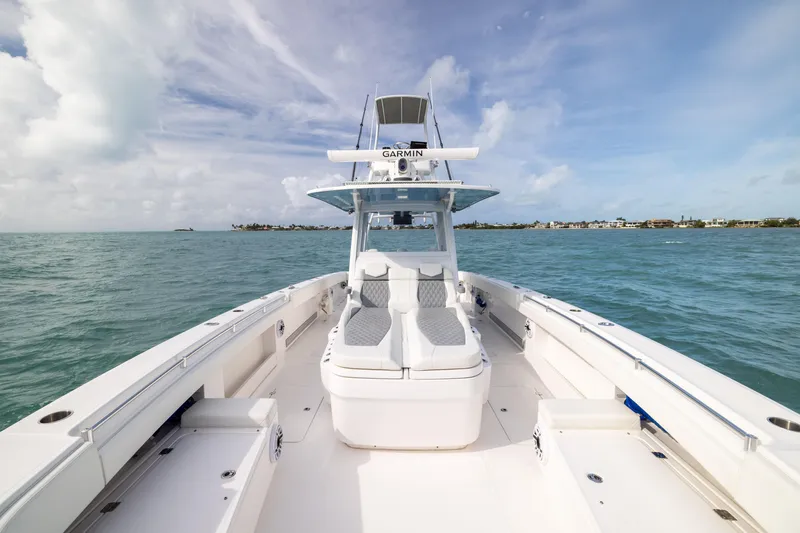 Slide: The Image of 2023 Invincible 37 Catamaran on open water, showcasing sleek design and spacious deck. - 15