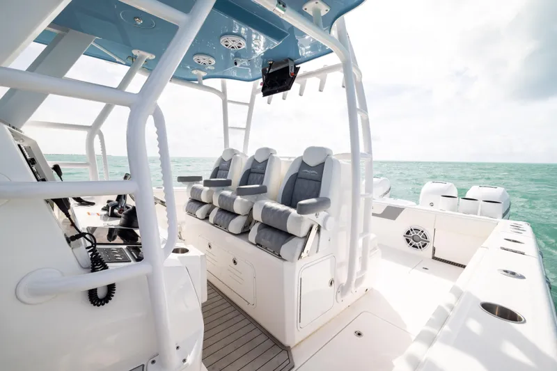 Slide: The Image of 2023 Invincible 37 Catamaran interior with luxurious seating and ocean view. - 18