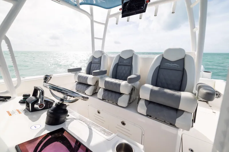 Slide: The Image of Luxurious seating on 2023 Invincible 37 Catamaran, featuring modern helm and ocean view. - 20