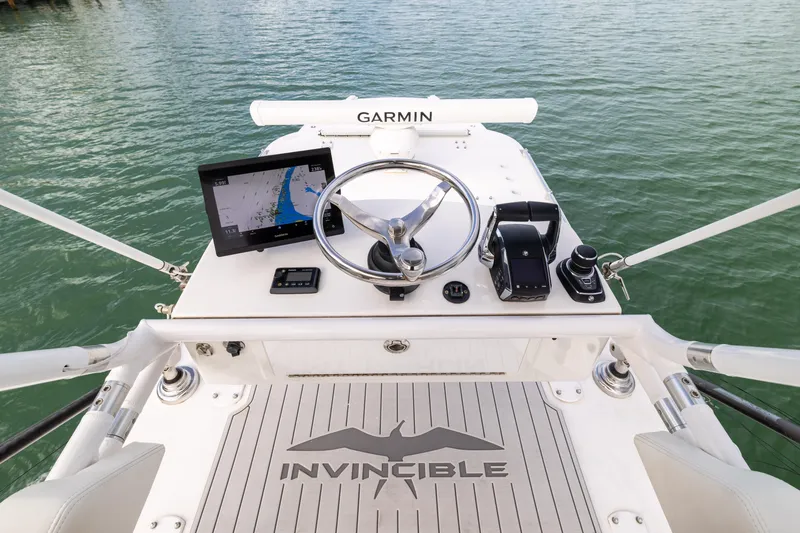 Slide: The Image of Cockpit view of 2023 Invincible 37 Catamaran with Garmin navigation system. - 24