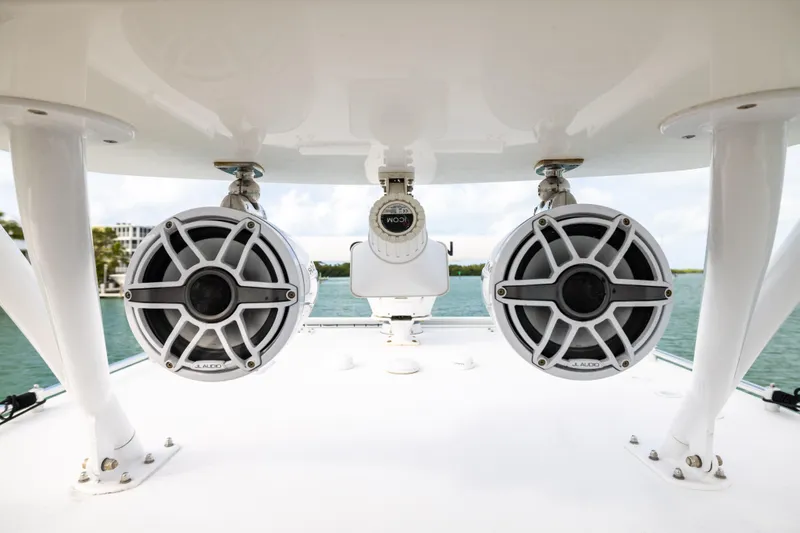 Slide: The Image of 2023 Invincible 37 Catamaran with JL Audio speakers on deck, ocean view. - 25