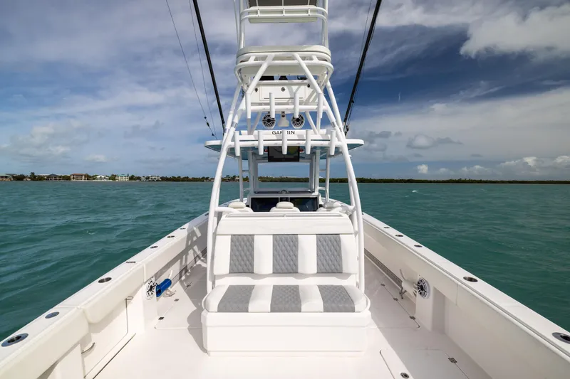 Slide: The Image of 2023 Invincible 37 Catamaran on open water, showcasing sleek design and spacious seating. - 28