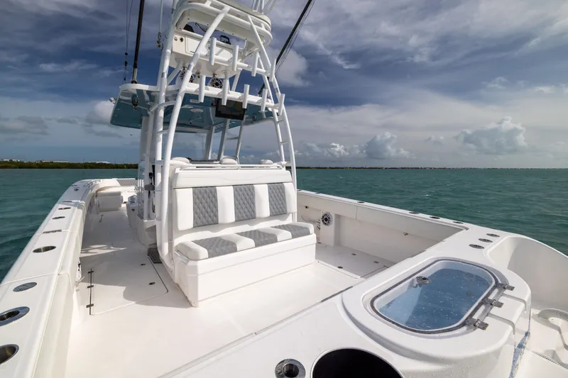 Slide: The Image of 2023 Invincible 37 Catamaran on open water, showcasing spacious deck and seating. - 29