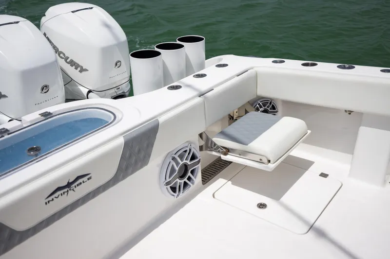 Slide: The Image of 2023 Invincible 37 Catamaran with Mercury engines, featuring a sleek fishing deck. - 38