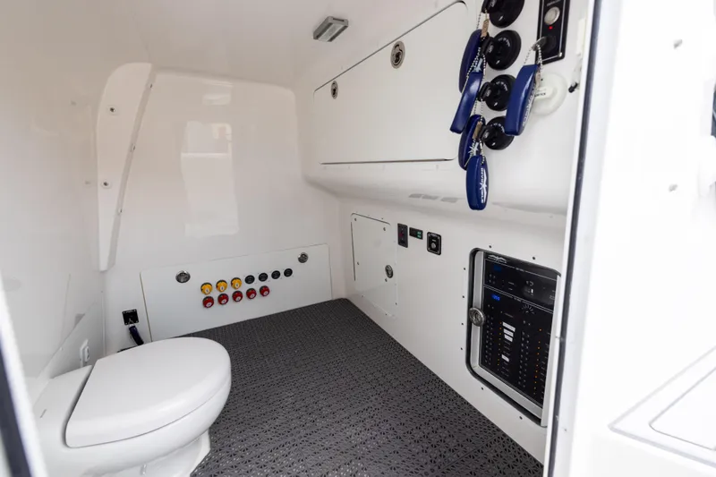 Slide: The Image of Interior of 2023 Invincible 37 Catamaran featuring control panel and marine toilet. - 42