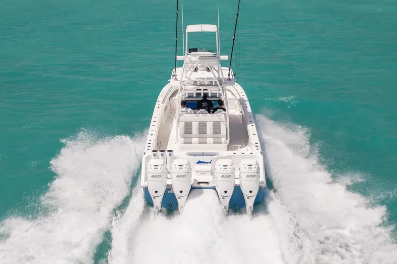 Slide: The Image of 2023 Invincible 37 Catamaran cruising on turquoise waters, rear view. - 5