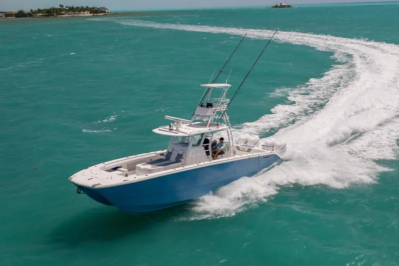 Slide: The Image of 2023 Invincible 37 Catamaran cruising on turquoise waters, showcasing sleek design and performance. - 8