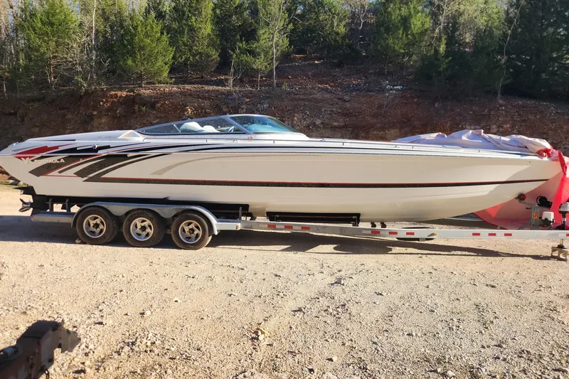 The Image of 2008 Formula 353 FASTech boat on trailer, parked outdoors with trees in background. - 1