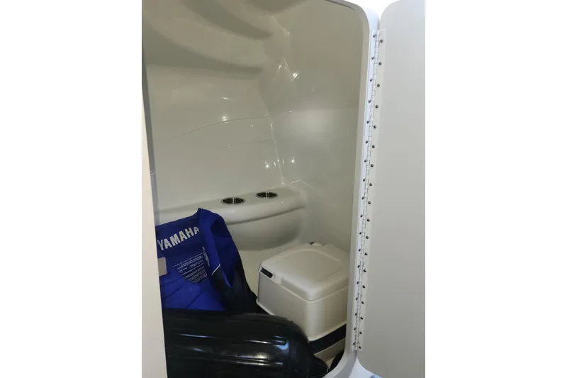 Slide: The Image of Interior of 2008 Formula 353 FASTech boat with storage and Yamaha life jacket. - 12