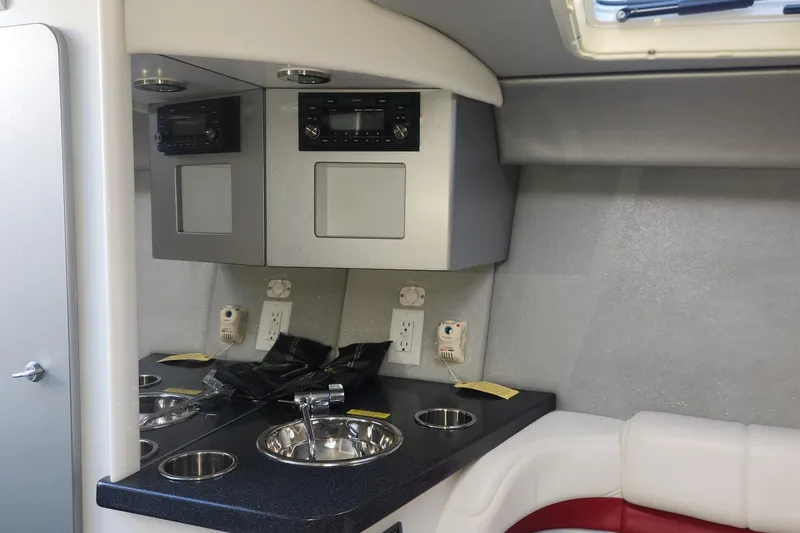 Slide: The Image of Interior of a 2008 Formula 353 FASTech boat with sink and storage cabinets. - 13