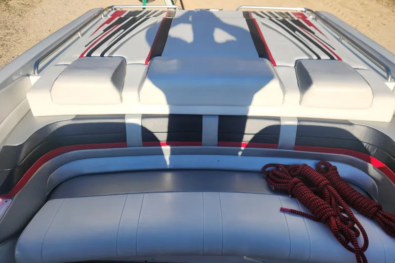 Slide: The Image of 2008 Formula 353 FASTech boat interior with red and black accents, featuring seating and ropes. - 16