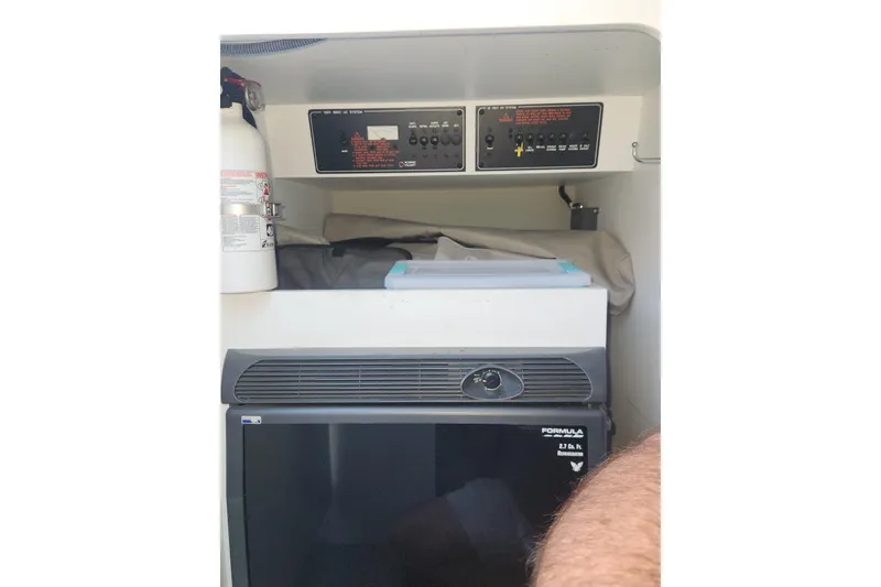 Slide: The Image of 2008 Formula 353 FASTech cabin interior with control panel and mini fridge. - 18