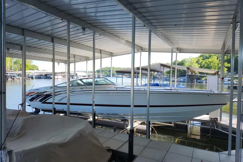 Slide: The Image of 2008 Formula 353 FASTech boat docked in a covered marina. - 3