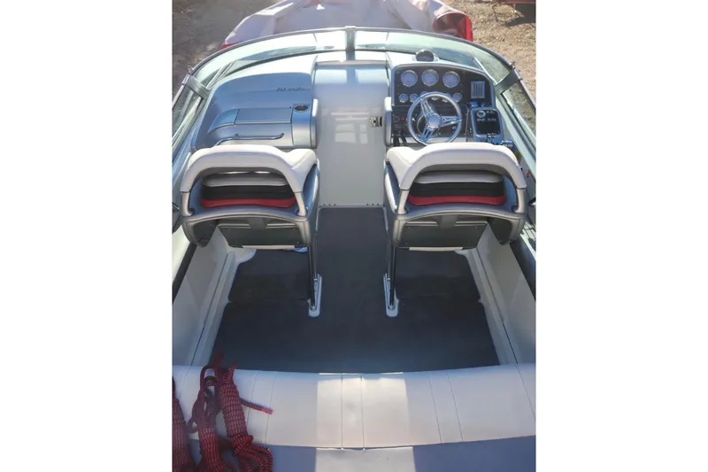Slide: The Image of 2008 Formula 353 FASTech boat cockpit with dual seats and control panel. - 4