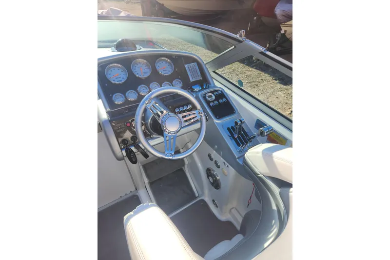 Slide: The Image of 2008 Formula 353 FASTech boat cockpit with steering wheel and instrument panel. - 5