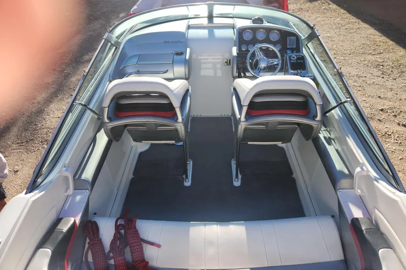 Slide: The Image of Interior of a 2008 Formula 353 FASTech boat, featuring sleek seating and a modern dashboard. - 6