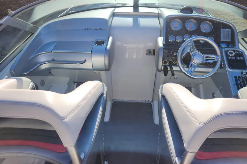 Slide: The Image of 2008 Formula 353 FASTech boat cockpit with sleek dashboard and steering wheel. - 7