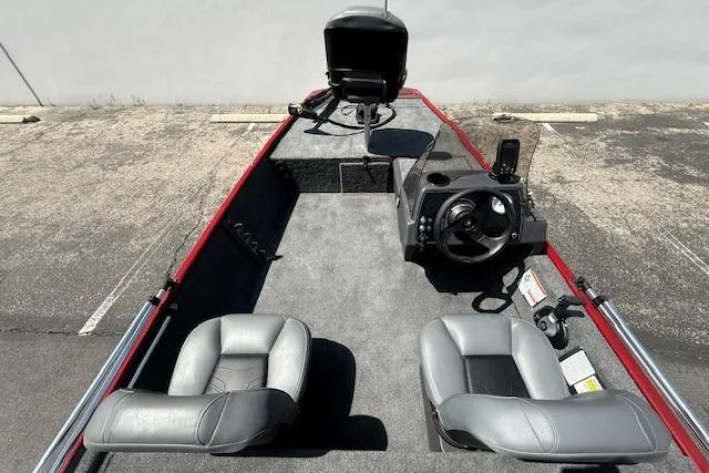 Slide: The Image of 2026 Tracker Bass Tracker Classic XL boat interior with steering console and seating. - 15