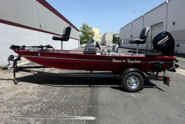 Slide: The Image of 2026 Tracker Bass Tracker Classic XL boat on trailer, parked outdoors. - 20