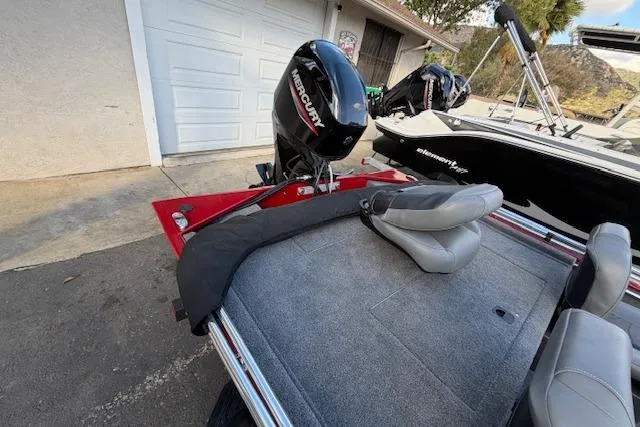 Slide: The Image of 2026 Tracker Bass Tracker Classic XL boat with Mercury outboard motor in driveway. - 3