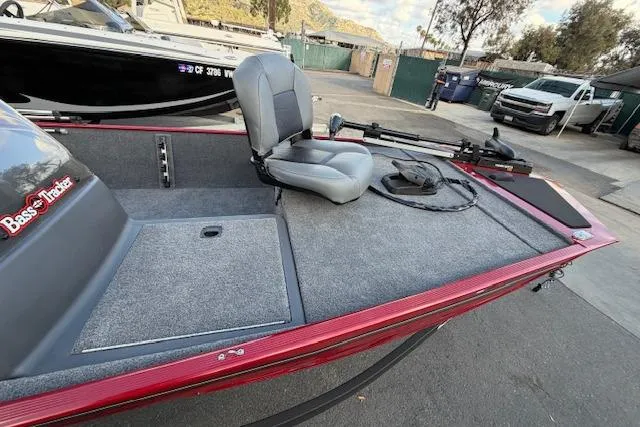 Slide: The Image of 2026 Tracker Bass Tracker Classic XL boat with gray seating and fishing equipment. - 6