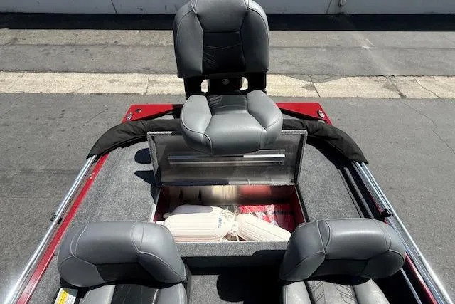 Slide: The Image of 2026 Tracker Bass Tracker Classic XL boat interior with gray seating and storage compartment. - 9