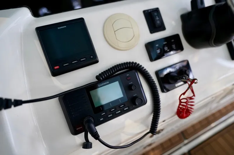 Slide: The Image of Control panel of a 2019 Cobia 344 Center Console boat with Garmin electronics. - 19