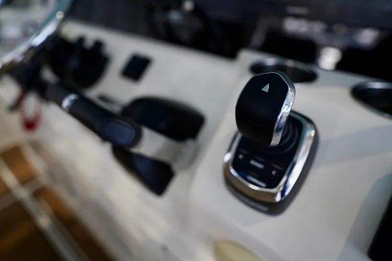 Slide: The Image of Close-up of 2019 Cobia 344 Center Console boat controls and throttle. - 23