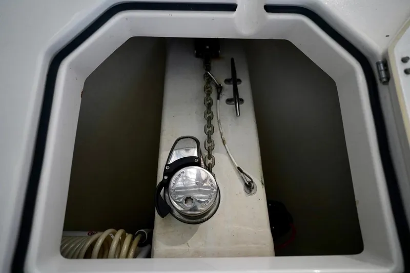 Slide: The Image of Anchor locker of 2019 Cobia 344 Center Console boat with chain and winch. - 38